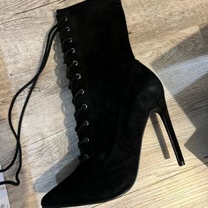Steve Madden. Heeled booties. Size 8.5. Never worn.